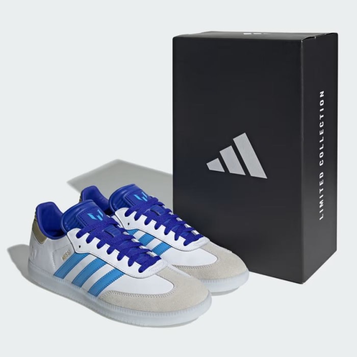 Side view of Lionel Messi's white and blue adidas Sambas.